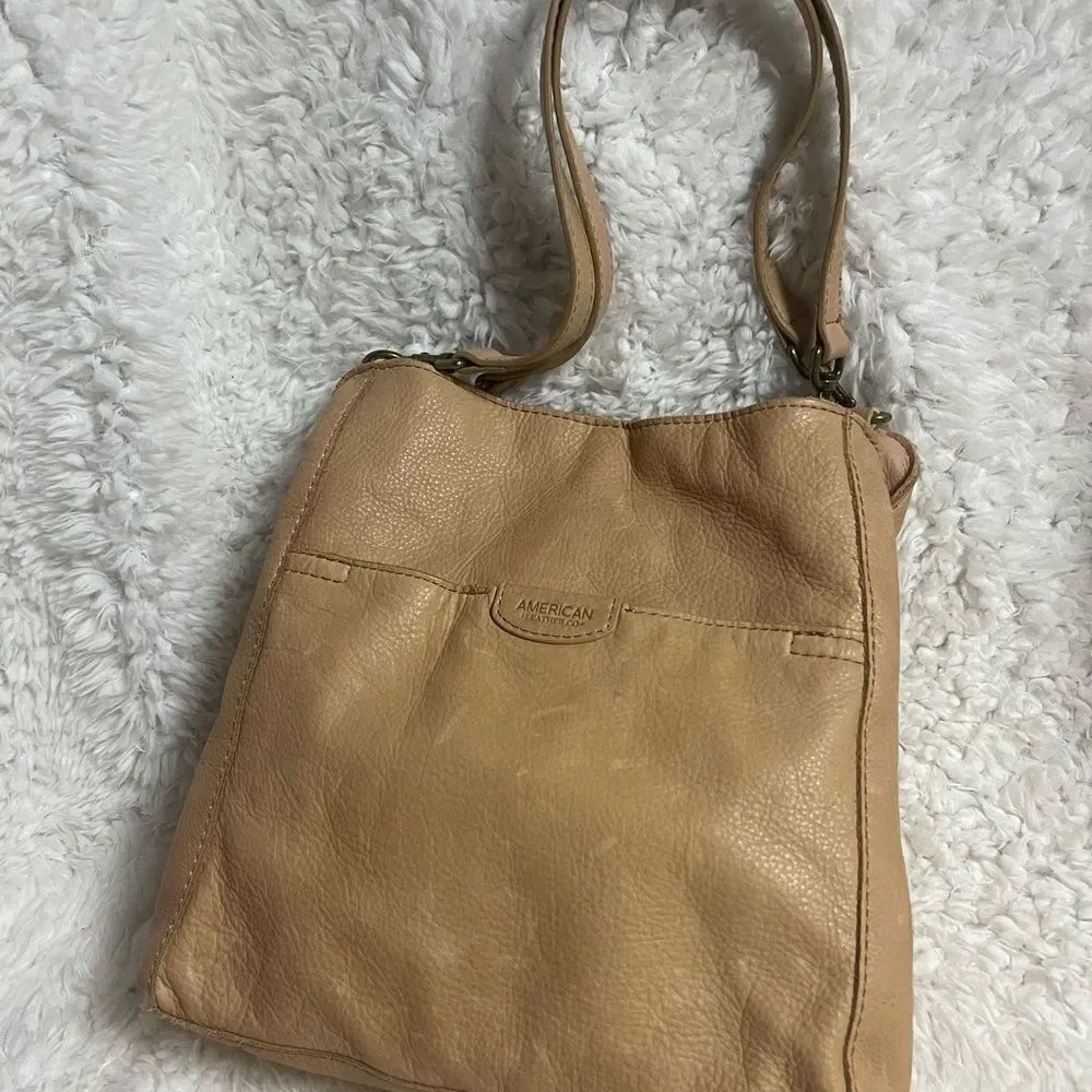 American soft Leather tan shoulder bag antique tone hardwares .